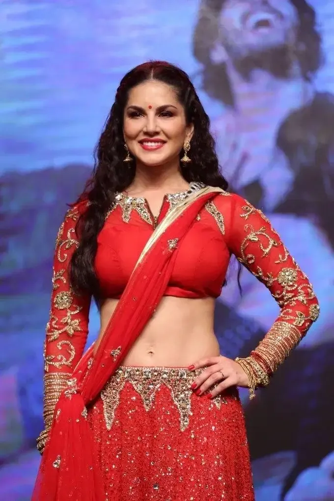 SUNNY LEONE IMAGES IN RED SAREE AT TELUGU MOVIE AUDIO LAUNCH 6